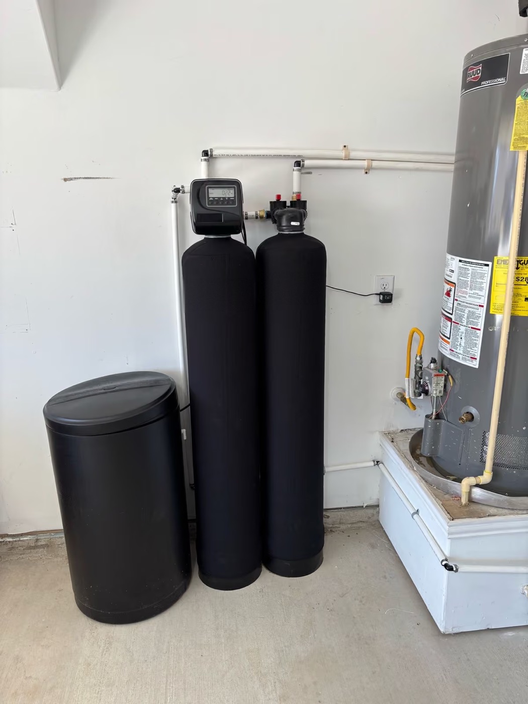 Twin tanks and brine tank plumbed in beside the water heater